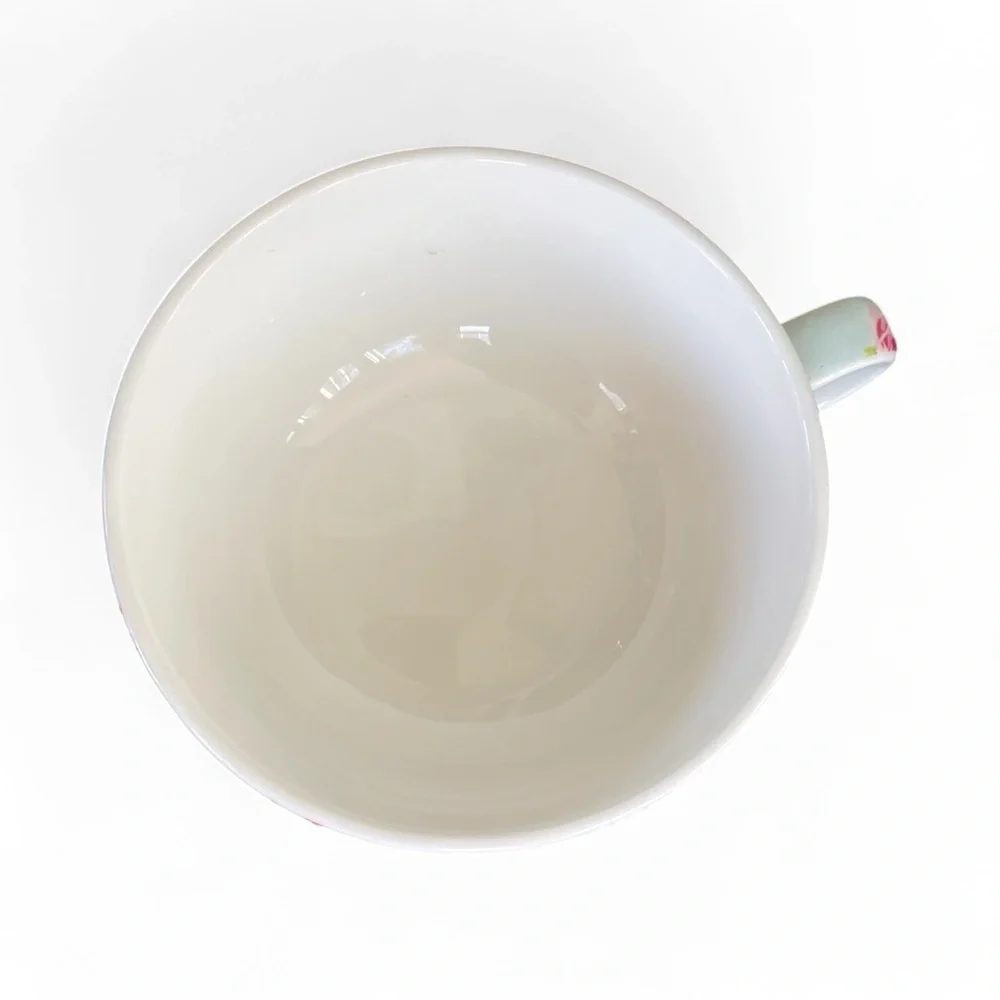 Small teapot with it’s own cup, charming, blue with roses, no flaws